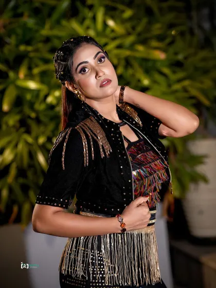 This portrait focuses on the attitude and the unique styling of the outfit. The confident expression and pose make for a powerful and memorable image.