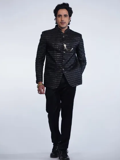 A full-length shot of the black sequined bandhgala. This is how you make an entrance.