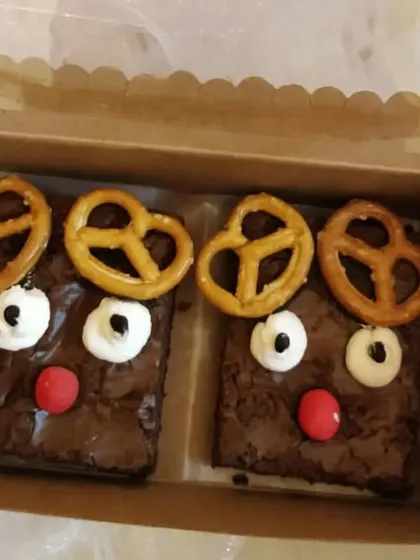 Our adorable reindeer brownies are a fun Christmas treat. We top our classic fudgy brownies with pretzels and icing to create these cute characters.