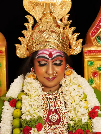 A serene yet powerful expression captured in this goddess look. Notice the detailed eye makeup with sharp winged liner and blended colors.