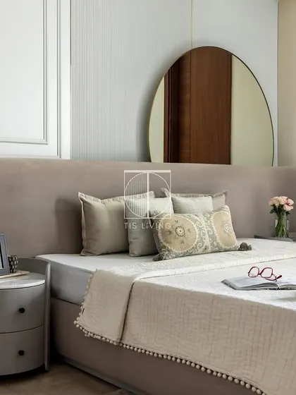 The full view of the guest bedroom highlights the balance between the soft, upholstered bed and the structured wall paneling. Every piece was designed by us to create a welcoming and stylish retreat for visitors.