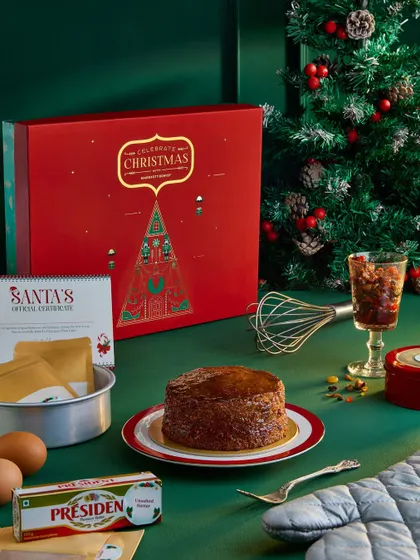 Another shot from the Marriott Christmas campaign, this time featuring a DIY cake kit. The composition includes ingredients like eggs and butter to tell the story of a fun, hands-on holiday activity.