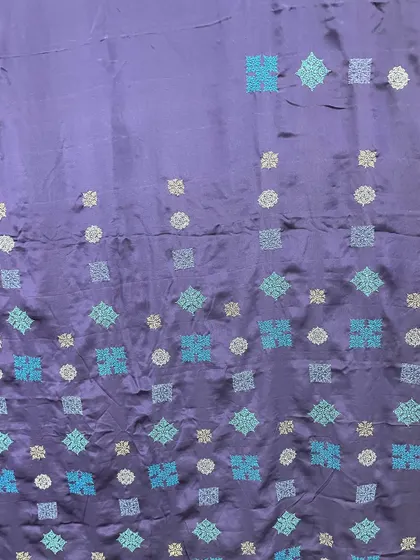 A different view of the contemporary Kasuti saree, highlighting the sheen of the crepe silk fabric and the shimmer of the embroidery threads.