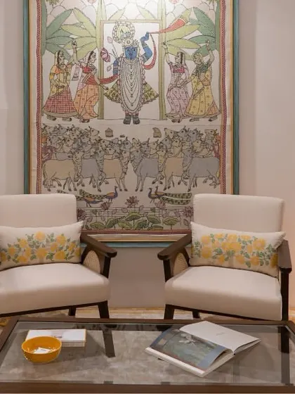 In our collaboration with Gaurang Home, these custom lounge chairs feature curvilinear forms and rattan handrests, paired with vibrant, nature-inspired textiles. This seating arrangement creates a living space that is rooted, personalized, and effortlessly sophisticated.