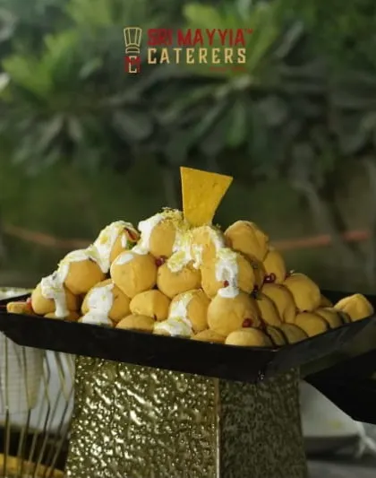 Even our chaat is presented with a touch of elegance. This creative display of Dahi Puri makes it an inviting and delicious centerpiece for your event's menu.