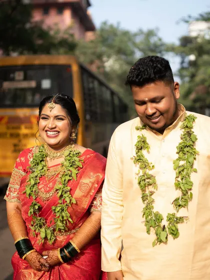 A fun and candid moment between the couple, their smiles telling a story of love and happiness.