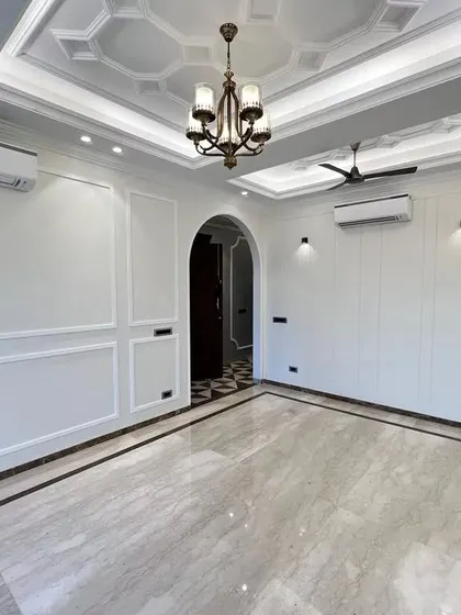 The arched entryway in this C-257 living room adds a touch of classical architecture. It perfectly frames the view into the next space, creating a sense of flow and grandeur.