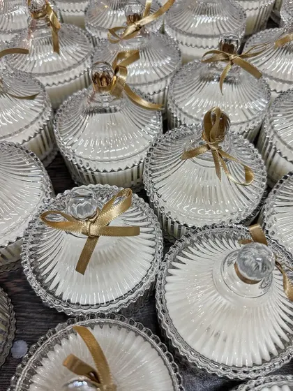 Another view of the elegant crystal jar candles, showing a large batch ready for a wedding. We ensure every candle is poured and packaged to perfection.