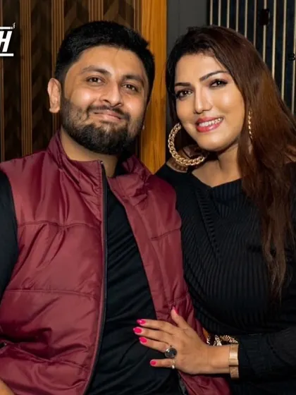 A couple posing for a photo, enjoying the vibrant nightlife of Koramangala.