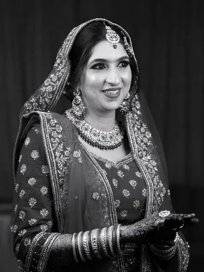 A timeless black and white portrait. This shot proves that great makeup stands the test of time, capturing the bride's happiness in a classic, elegant way.
