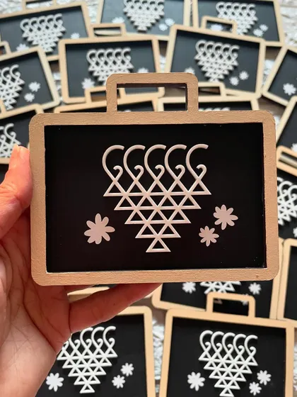 These 'Saraswati Pati' magnets are perfect for Saraswati Pujan or as return gifts for students. They are designed to look like a traditional slate.