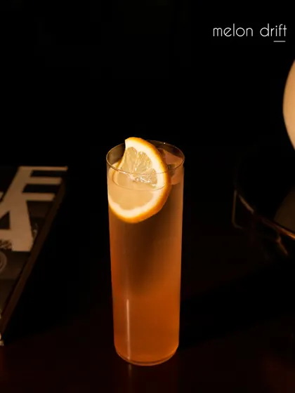 Another view of our Melon Drift cocktail, a refreshing blend of 06 Rose Vodka, musk melon, and lime. Orange bitters and a saline solution enhance the fruit's flavor, creating a perfectly balanced and effervescent highball.