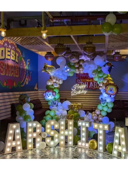 A wide shot of the "Desi Swag" restaurant decorated for Harshita's jungle party, showing how our decor complements the venue's existing style.