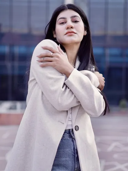 A soft, introspective pose that adds emotional depth to a fashion portfolio.