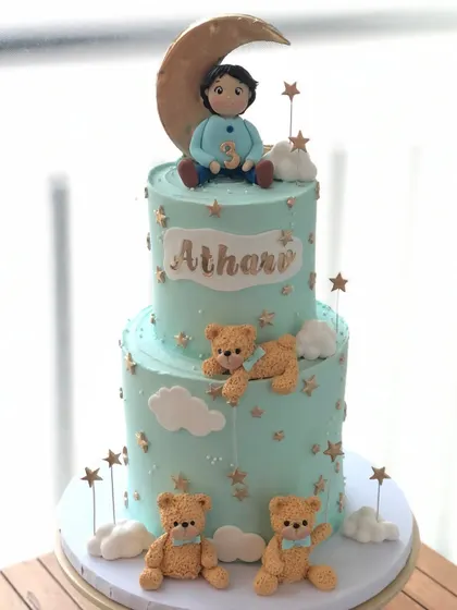 A full view of the beautiful two-tiered moon and teddy bear cake.
