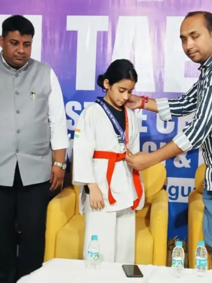 The moment a champion is recognized. Naysha Sharma receiving her gold medal after a fantastic performance at the state championship.