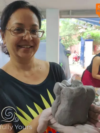 The proud smile of a happy creator holding her finished capsicum sculpture. This is the feeling of accomplishment I hope everyone leaves my studio with.