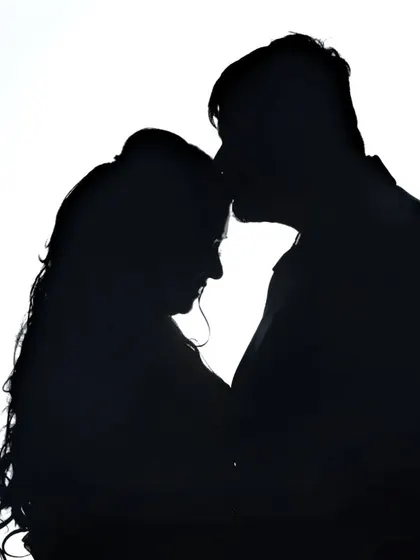 An artistic silhouette portrait that focuses on the couple's connection. This style of creative wedding photography creates timeless and dramatic images you will cherish forever.