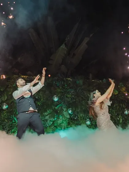 A magical dance performance by the couple, surrounded by smoke and sparklers, creating a truly cinematic Sangeet moment.