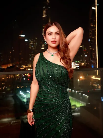 A glitter and glam look I styled for Neha Malik for an event in Dubai. This emerald green sequin gown with a dramatic train was perfect for a night out, set against the stunning backdrop of the Burj Khalifa.