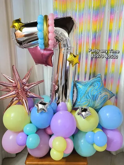 Another version of the pastel 7th birthday bouquet against a shimmer curtain.