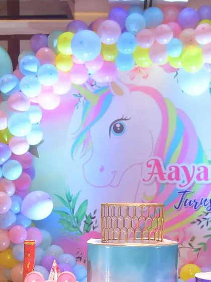 A close-up of the unicorn backdrop, showing the beautiful artwork and the soft, glowing lights that add to the magic.