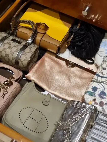 You don't need huge shelves to organize your clutches and small handbags. These images show how drawers with simple dividers can be the perfect home for your collection.