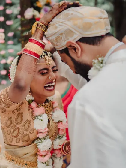 A moment of pure fun and laughter between the bride and groom during their South Indian wedding ceremony. It's these unscripted interactions that truly tell their love story.