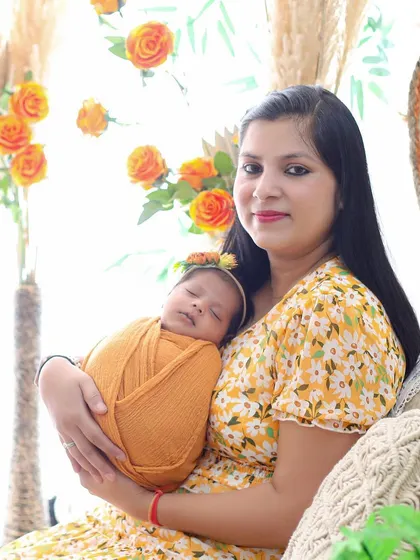 A candid moment between mother and daughter. Dressed in coordinating yellow, this portrait radiates warmth, happiness, and the simple joy of motherhood.