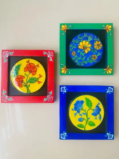 A trio of small, framed floral art pieces. Inspired by the blue pottery of Rajasthan, I expanded the collection to include red and green frames for a client who wanted a colorful set.