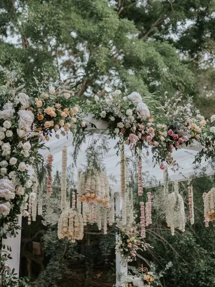 This elegant mandap is a fusion of contemporary and traditional design. We used a canopy of pastel florals and intricate hanging arrangements to create a dreamy, romantic space for the wedding ceremony.