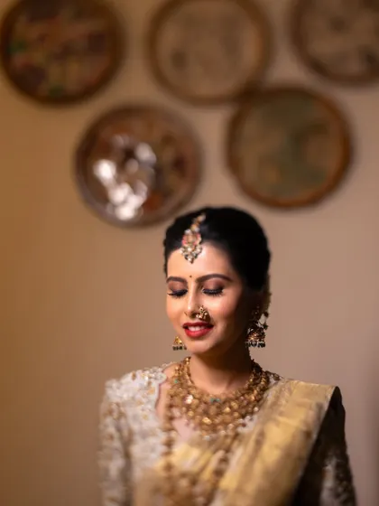 A soft-focus portrait of the bride, her eyes closed, capturing a moment of serene happiness.