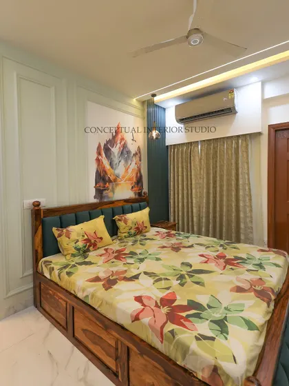 A bedroom that combines a traditional wooden bed with modern wall treatments. I used light green molding and a dark accent wall to create a balanced and serene space.
