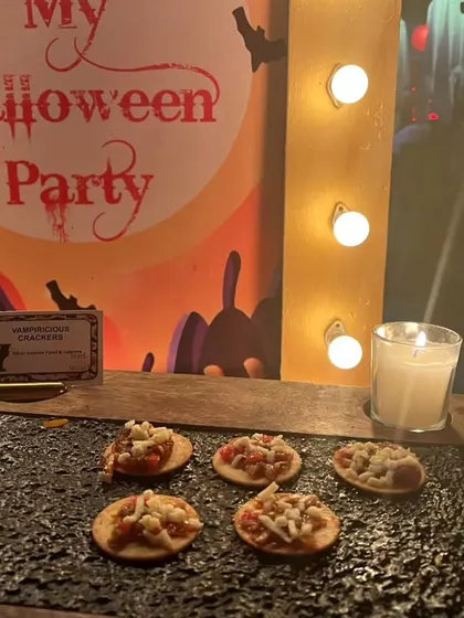 "Vampiricious Crackers" on display at our Halloween party, set against a fun, spooky backdrop. We love creating themed names for our dishes!