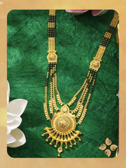 Celebrate love and tradition with this multi-string gold mangalsutra. The classic design with a circular pendant is perfect for the modern woman who cherishes her roots.
