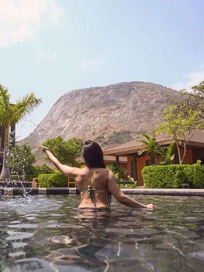 This is your moment to pause. Imagine yourself here, enveloped by the calm waters of our pool, with the majestic Nandi Hills standing guard. We have crafted this sanctuary for your ultimate relaxation and rejuvenation.