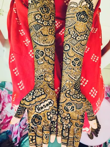 A personalized bridal design with the initials 'AH' and the name 'Hasan' beautifully incorporated.