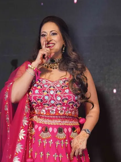 A candid shot of a performer enjoying her moment on stage. We focus on making everyone feel confident, so their happiness shines through in every step.