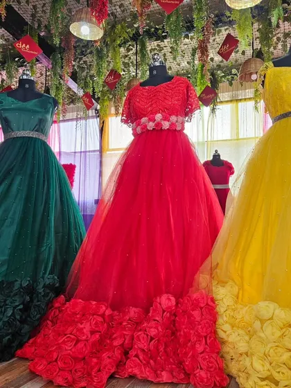 A full display of our three rose-hem ball gowns, perfect for making a colorful statement.