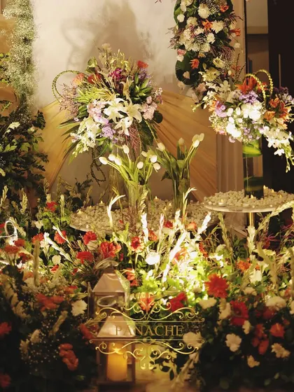 A floor-level view of the lush floral arrangements that surrounded the main stage.