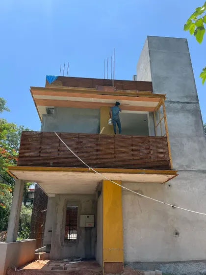 A front view of the house during the finishing stages.