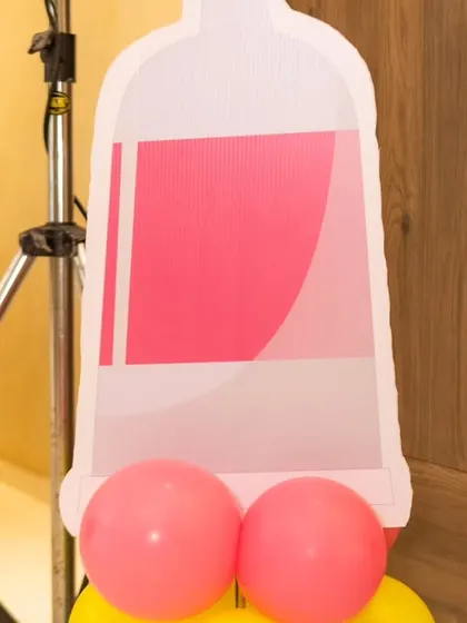 A close-up of a paint tube cutout with a balloon base, part of our Art & Paint party theme.
