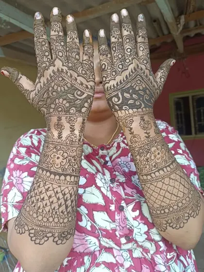 A full-coverage design on the back of the hands, featuring a mix of checks, floral bands, and delicate vine patterns.
