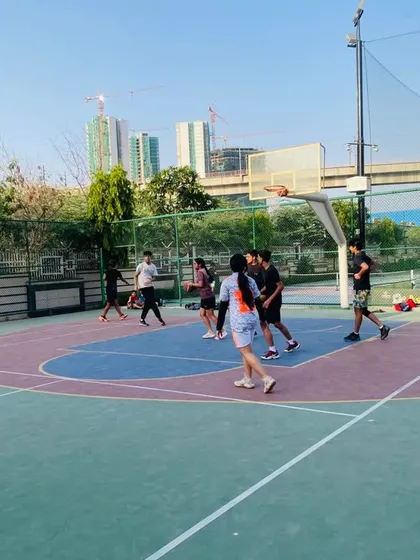 A view of the court during an evening game, with the city skyline in the background.