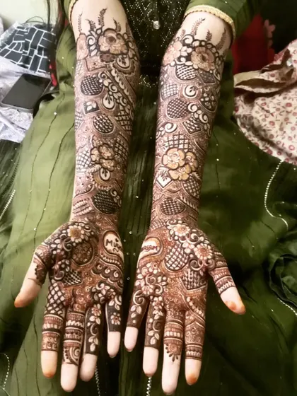 A full bridal design for the beautiful Tabassum, featuring personalized initials. The mix of floral and geometric patterns creates a stunning look.