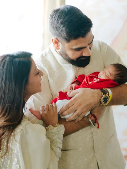 A new family begins. This lifestyle newborn session captures the awe and love of new parents.