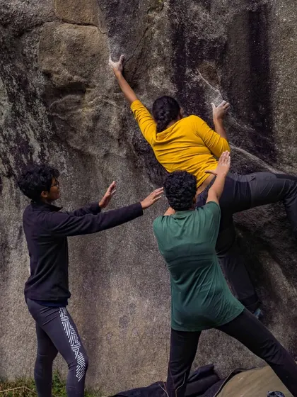 Spotting is an art. Here, two women provide a perfect "human crash pad" for their friend, demonstrating the trust and teamwork we practice.