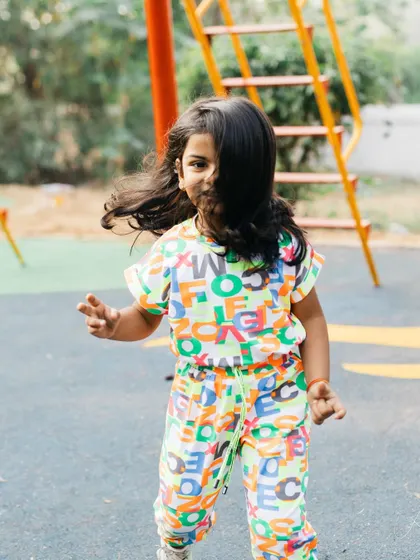 Her hair flying across her face as she runs. This is the wild child moment I love, capturing her spirit and the joy she finds in simple play.