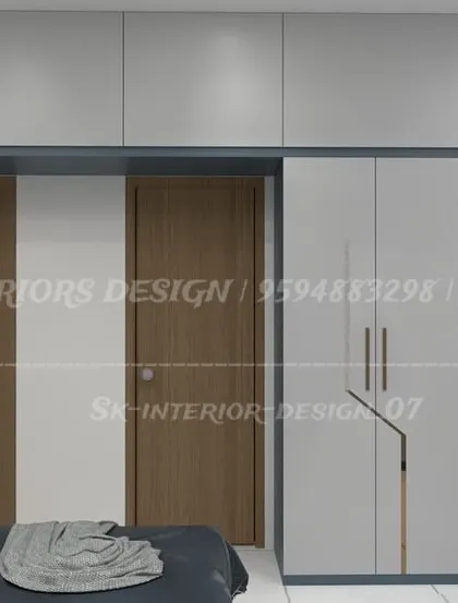 A dual-tone wardrobe design in white and blue with sleek, modern handles. The loft storage above provides extra space, making it ideal for compact bedrooms.