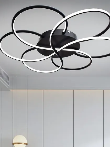 Another view of the modern floret chandelier, showing its clean lines and sculptural form. It provides excellent ambient light for a living room or hallway.